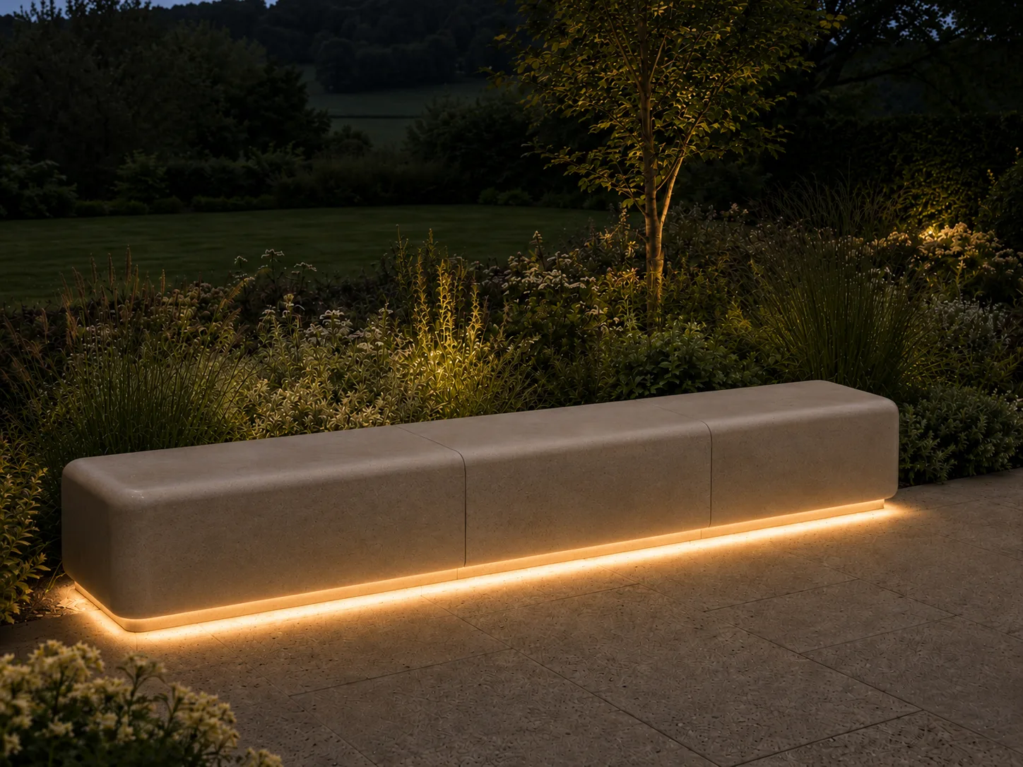A stone bench with soft lighting underneath, set in a garden during the evening.